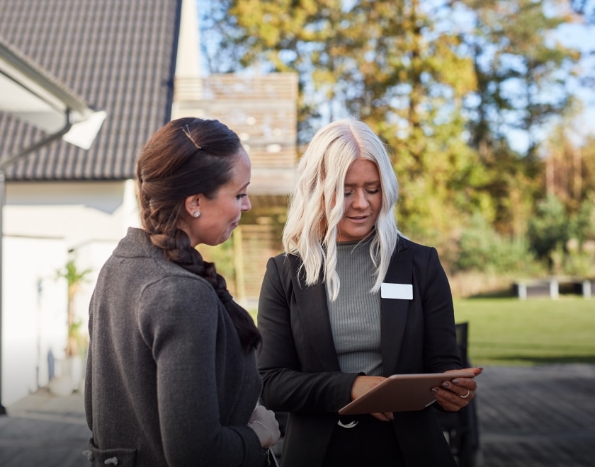 estate agent talking to woman